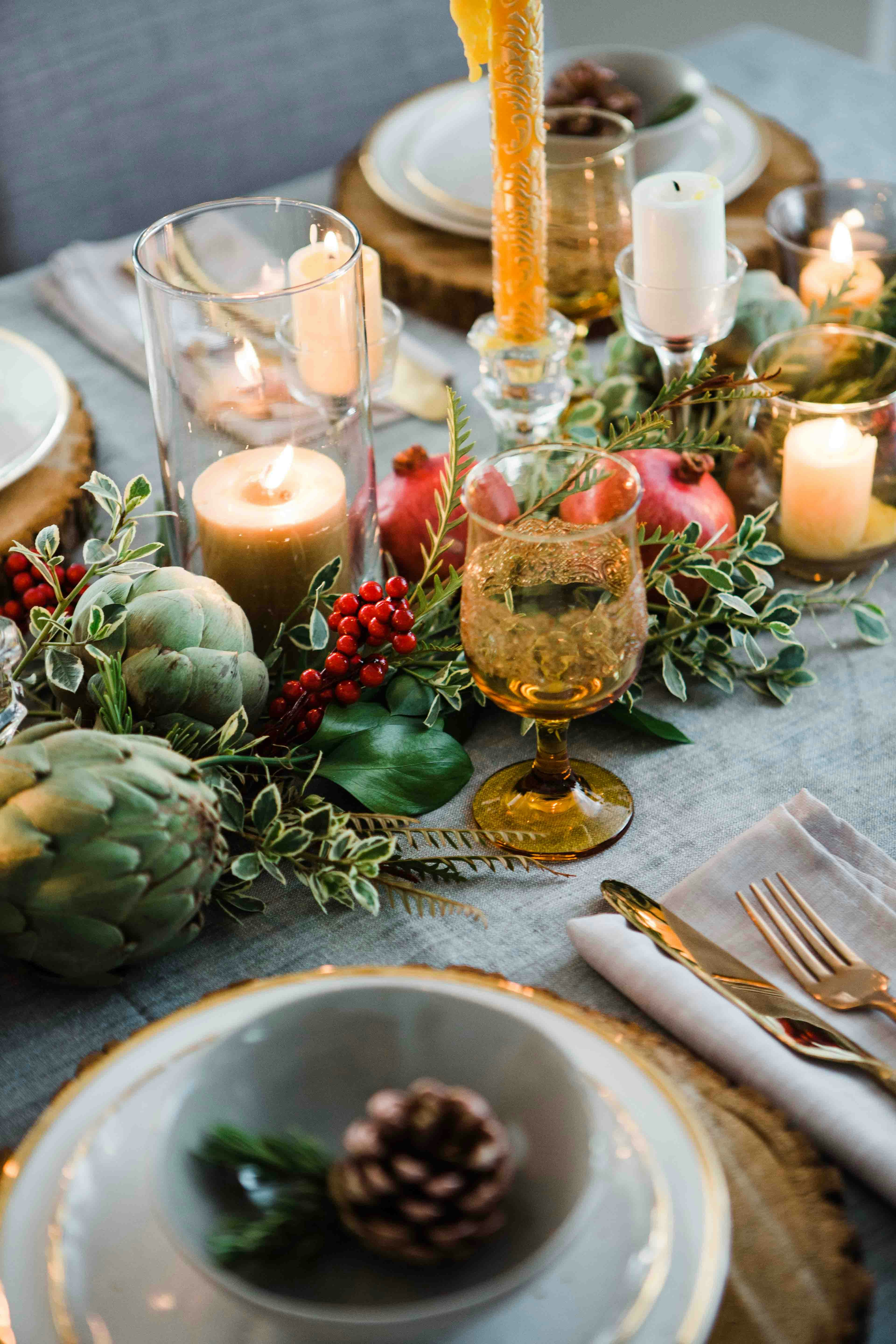 round green fruits on table beside footed glass